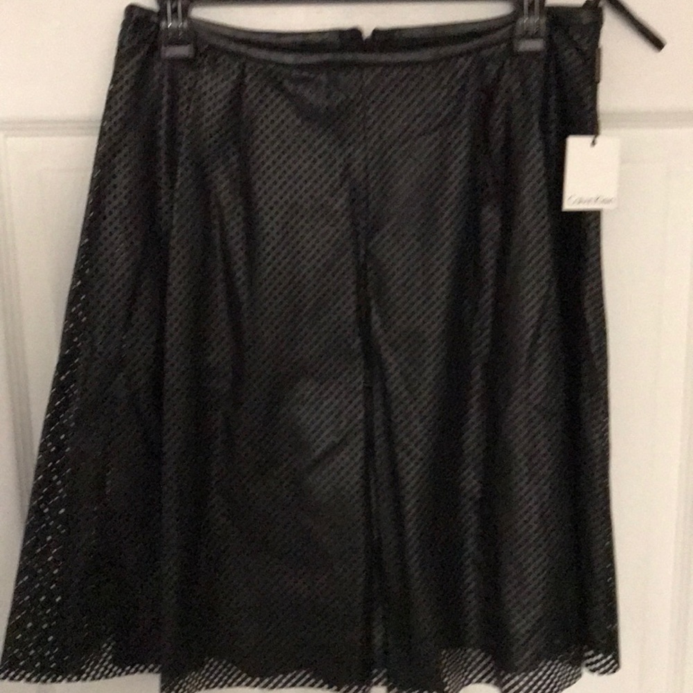 Ladies Calvin Klein mesh black skirt..NWT